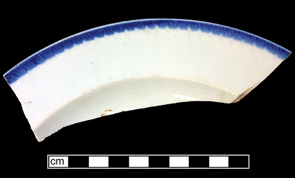 Impressed blue edged unscalloped refined white earthenware plate. Rim diameter:  8.50”, from 18BC27, Feature 30.